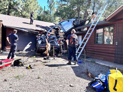 Out-of-control SUV comes to rest in tree on north Durango property