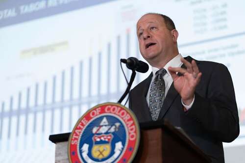 Colorado governor cuts spending on Medicaid, higher education and grants to plug $750M hole in state budget