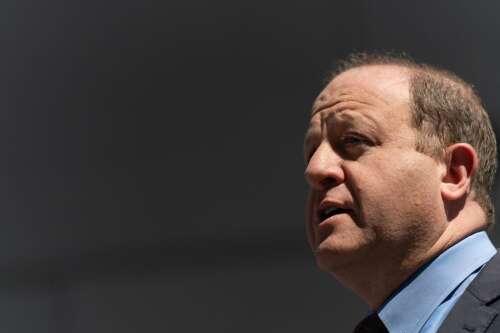 As some Democratic governors lead on ICE pushback, Jared Polis takes a hands-off approach