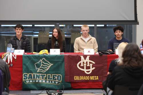 Four student-athletes participate in college signing ceremony at DHS