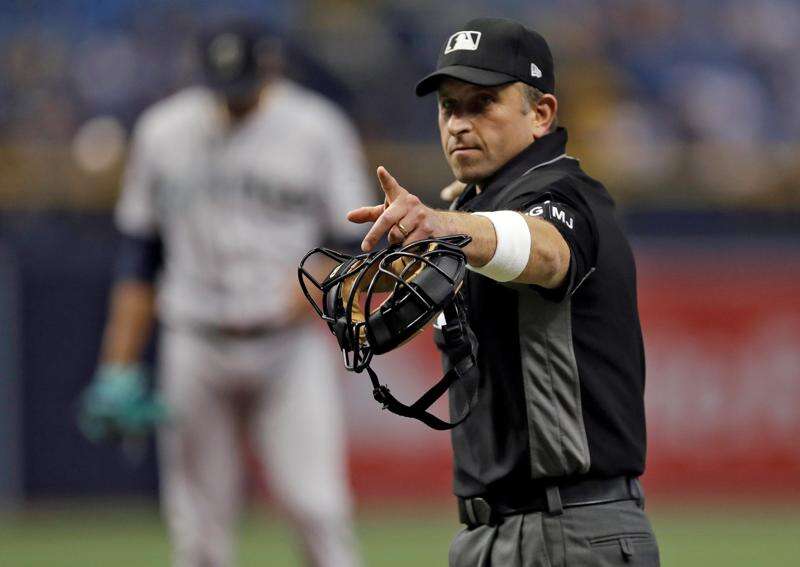 Major league umpires wear wristbands to protest 'escalating verbal