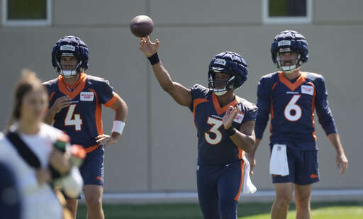 Denver Broncos quarterback Russell Wilson tosses out the first