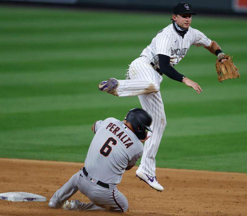 June 24 2015: Colorado Rockies Infielder, DJ LeMahieu (9) heads for third  base during a regular season major league baseball game between the Colorado  Rockies and the visiting Arizona Diamondbacks at Coors