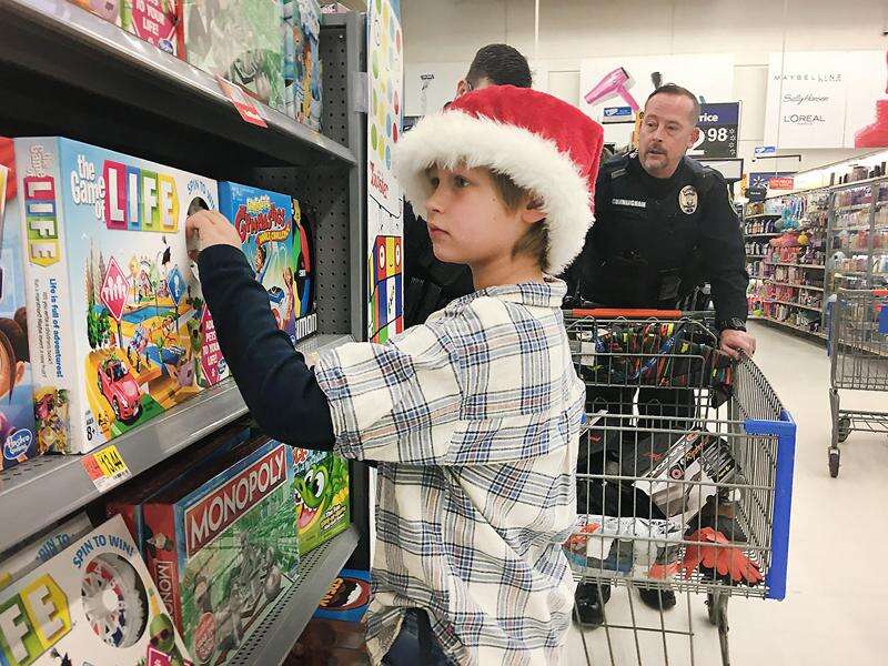 125 Durango-area children 'Shop with a Cop' at Walmart – The