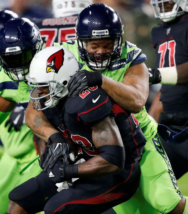 Cardinals' D.J. Humphries, Tyvon Branch leave game with knee injuries