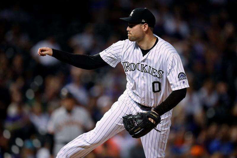 Carlos Gonzalez of the Colorado Rockies leads off second base