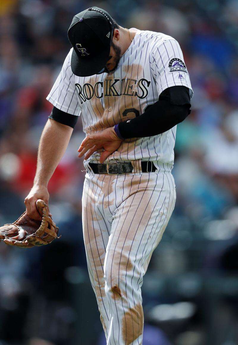 Colorado Rockies Nolan Arenado re injures left hand against