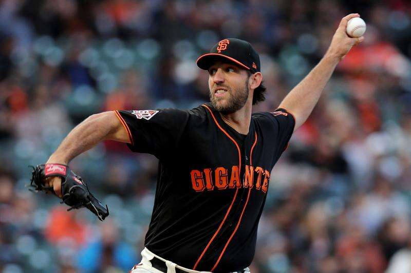 Giants' Madison Bumgarner dominates Rockies on the mound; also hits homers