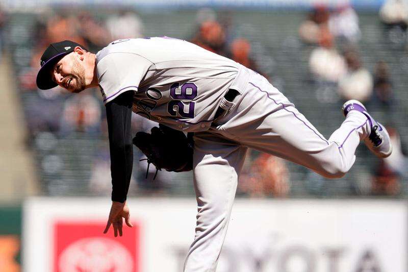 Johnny Cueto pitches Giants past Rockies 3-1 in home opener