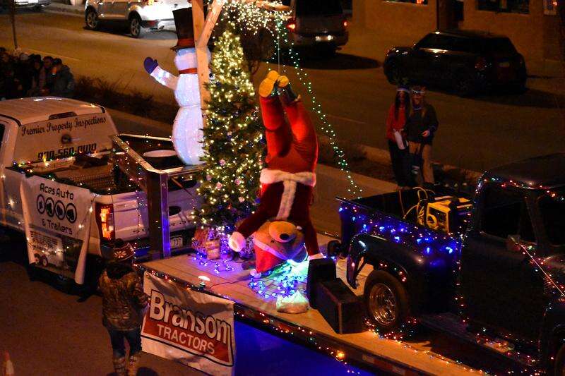 Grinch truck delivers holiday cheer and hope to the QCA 