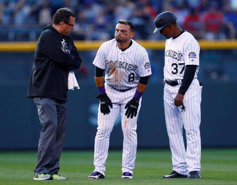 Complete with bushy beard and mullet, Blackmon leads Rockies