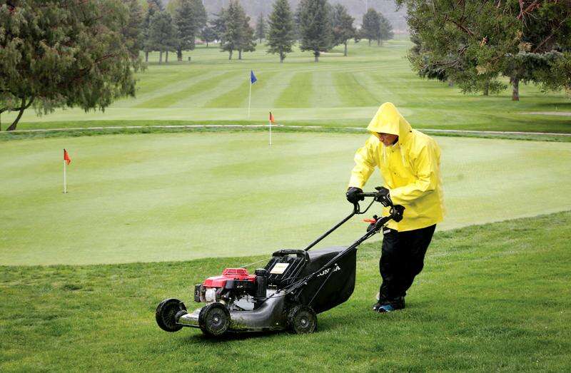 Mowing grass in the rain top