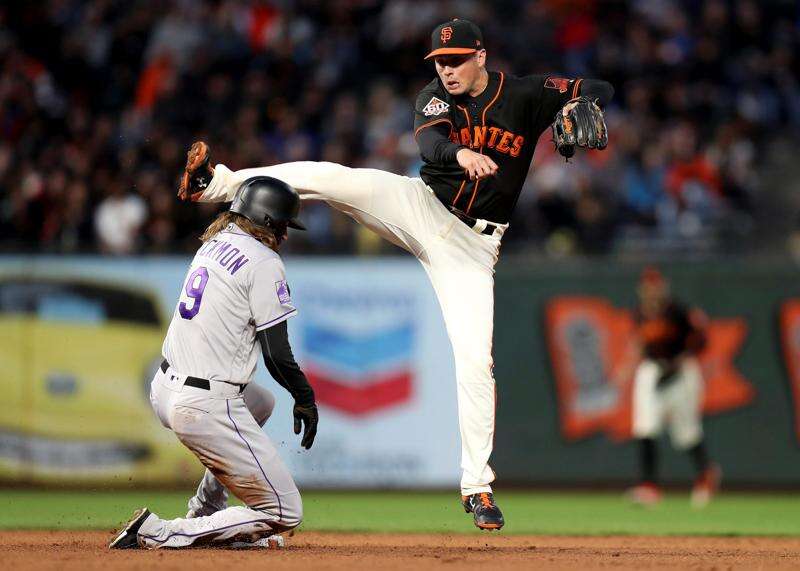 Giants' Madison Bumgarner dominates Rockies on the mound; also hits homers