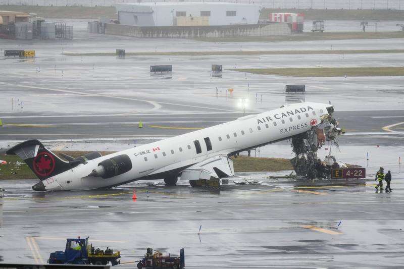Air Canada flight collides with fire truck on runway at New York's LaGuardia Airport; pilot, co-pilot die