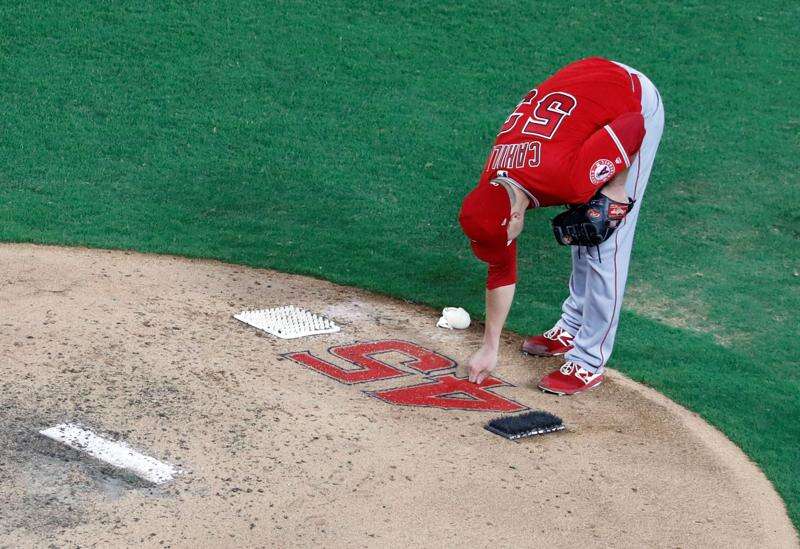 Angels back in Texas after Skaggs' death, lose to Rangers