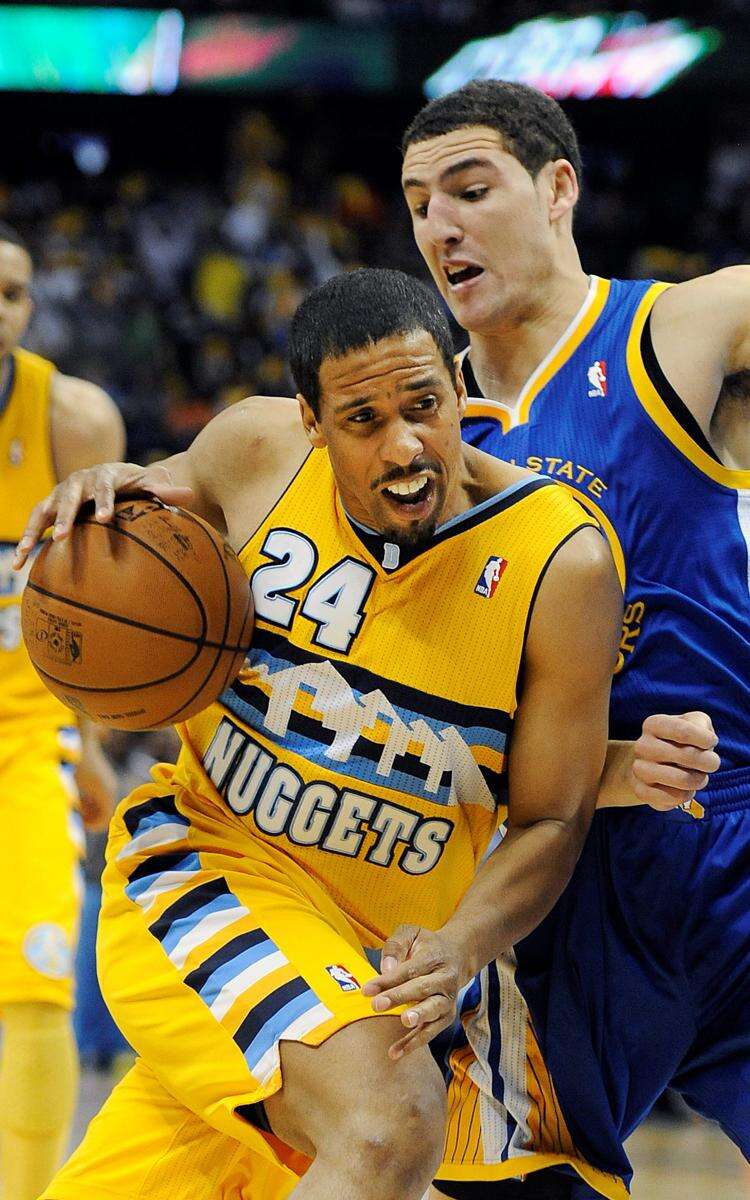 The Denver Nuggets' Andre Miller shoots during the second half of