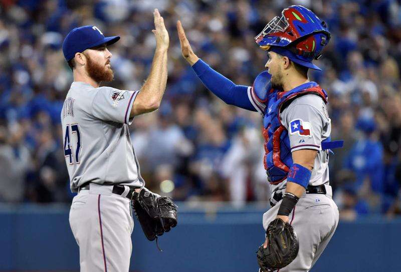 Prince Fielder touches Adrian Beltre's head one last time before