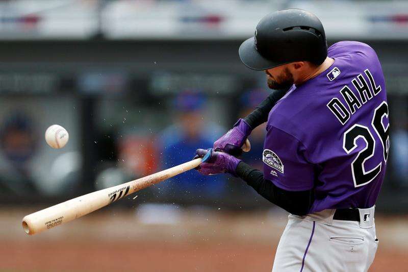 Colorado Rockies' Ian Desmond bats against the Washington