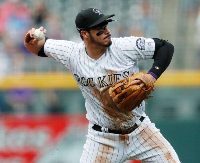 Nolan Arenado,COL, with the 2106 NL Gold Glove for third base//April 7,  2017 v LAD
