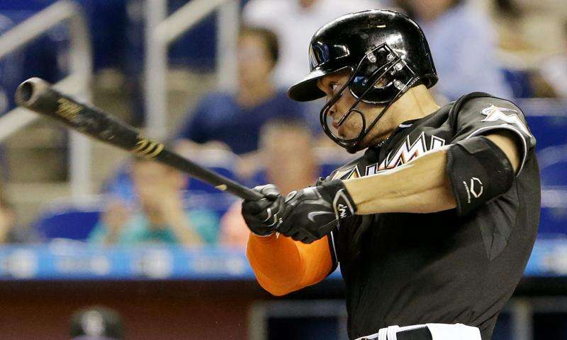 Hit by Pitch, the Miami Marlins' Giancarlo Stanton Is Taken to