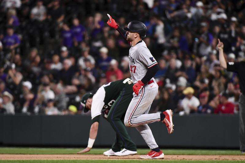 Playoff-bound Twins hit 3 homers in 7-6 victory over Rockies