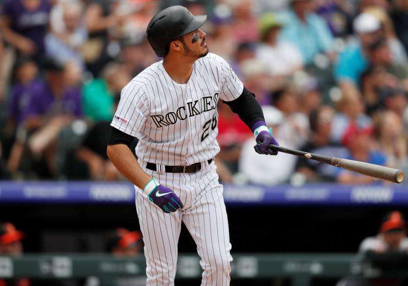 Colorado Rockies Tony Wolters (14) scores on RBI-double hit by