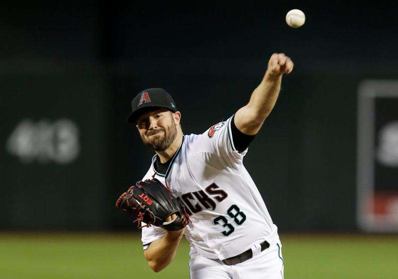 Arizona Diamondbacks starting pitcher Robbie Ray (38) throws