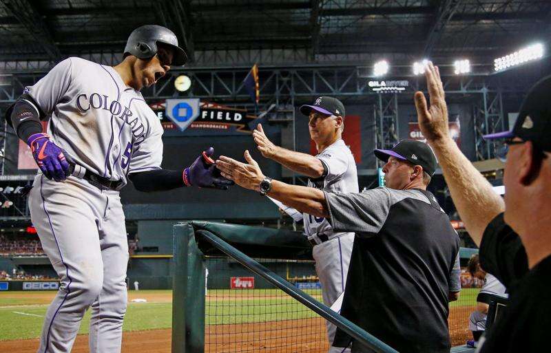 Carlos Gonzalez of the Colorado Rockies leads off second base