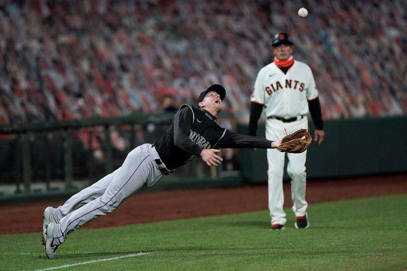 San Francisco Giants Evan Longoria makes a catch during practice