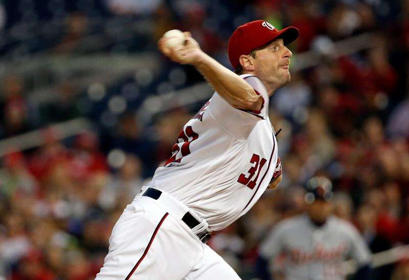 Washington Nationals starting pitcher Max Scherzer, left, stands