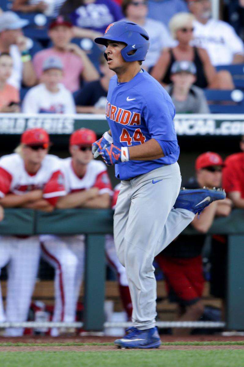 Brady Singer, Florida topple Louisville at College World Series