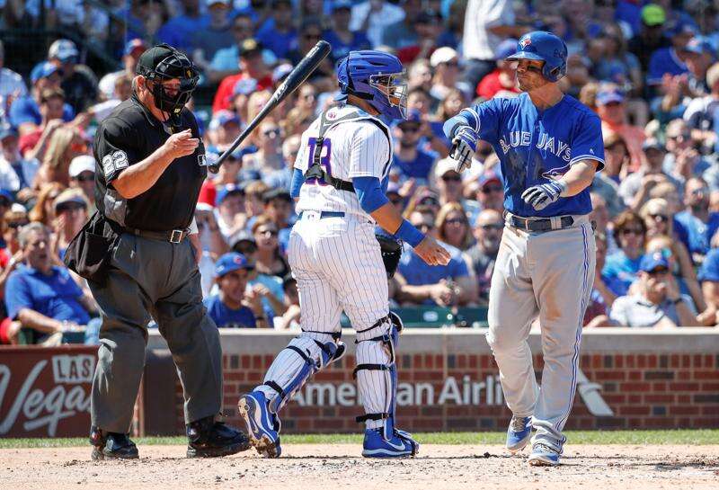 Major league umpires wear wristbands to protest 'escalating verbal attacks'  from players 