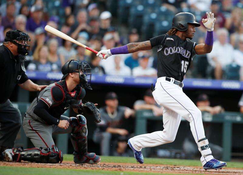 Arizona Diamondbacks' David Peralta goes down after fouling a ball