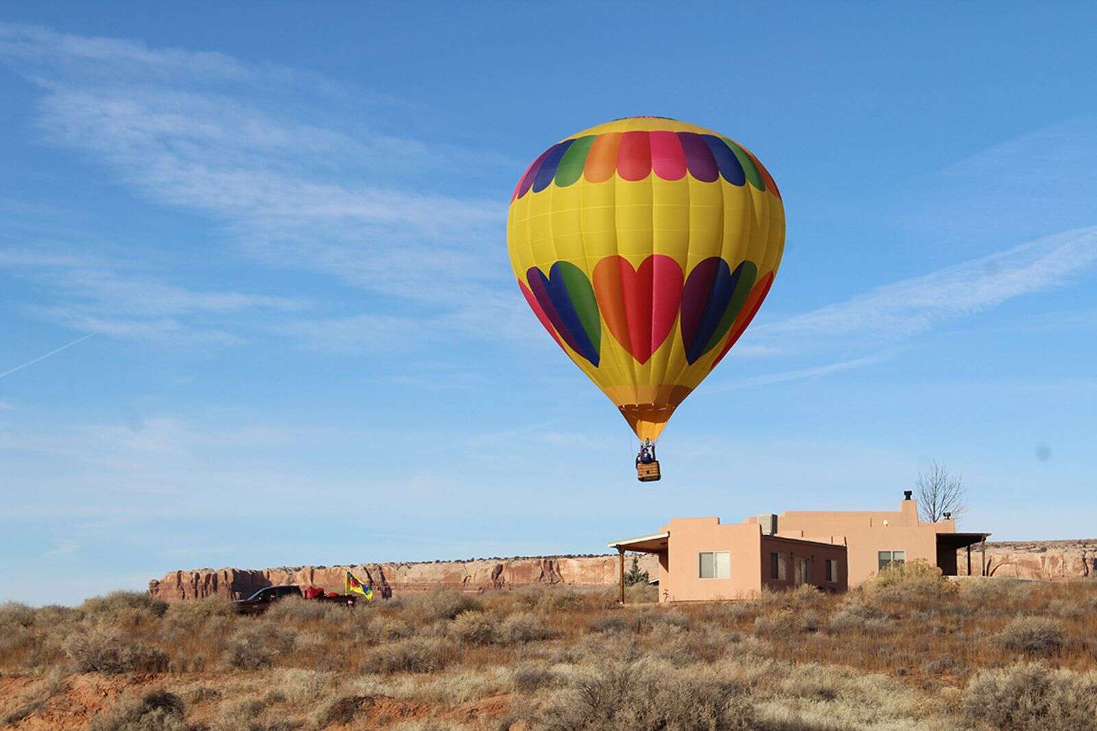 Balloons rise above red rocks The Bluff, Utah, Balloon Festival The