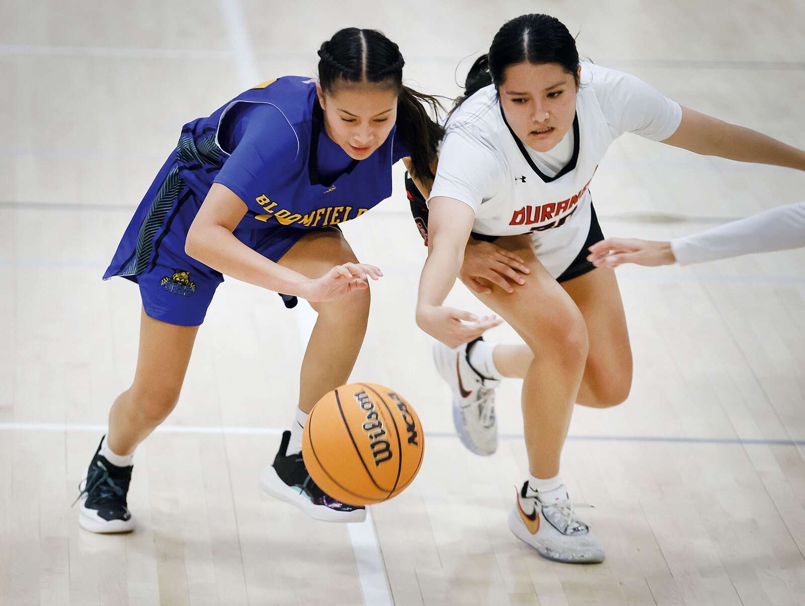 Katelynn Sheppard of Durango High School and Lyssea Mescal of Bloomfield High School go for a loose ball on Tuesday, Jan. 9, 2024, while playing at DHS. (Jerry McBride/Durango Herald)